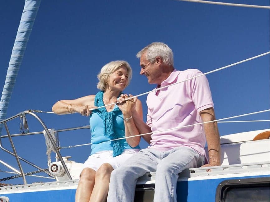 A retired couple sailing together